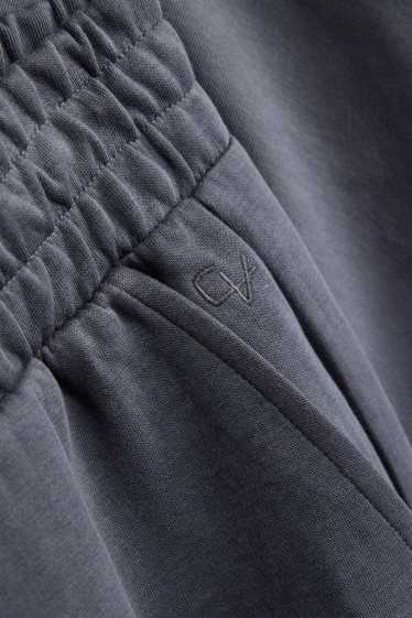 Uomo - Pantaloni sportivi - grigio