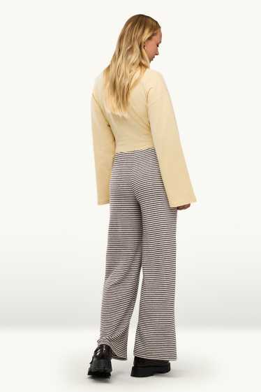 Femei - Pantaloni din jerseu - talie medie - wide leg - cu dungi - maro / alb-crem