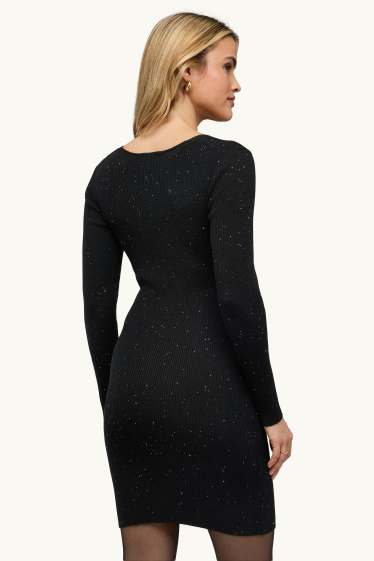 Dames - Wikkeljurk - geribd - glanseffect - zwart