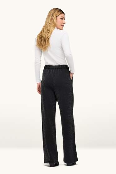 Women - Cloth trousers with belt - high waist - wide leg - shiny - black