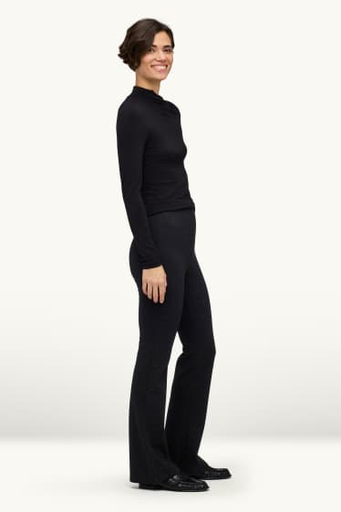 Femei - Pantaloni de stofă cu ștrasuri - talie medie - evazați - negru