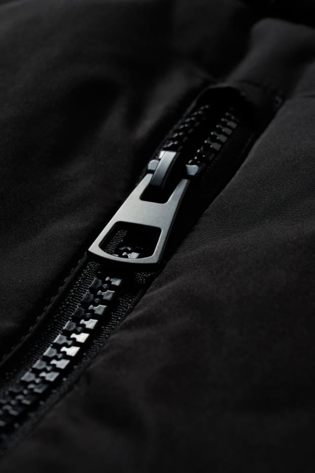 Donna - Gilet trapuntato con cappuccio - nero