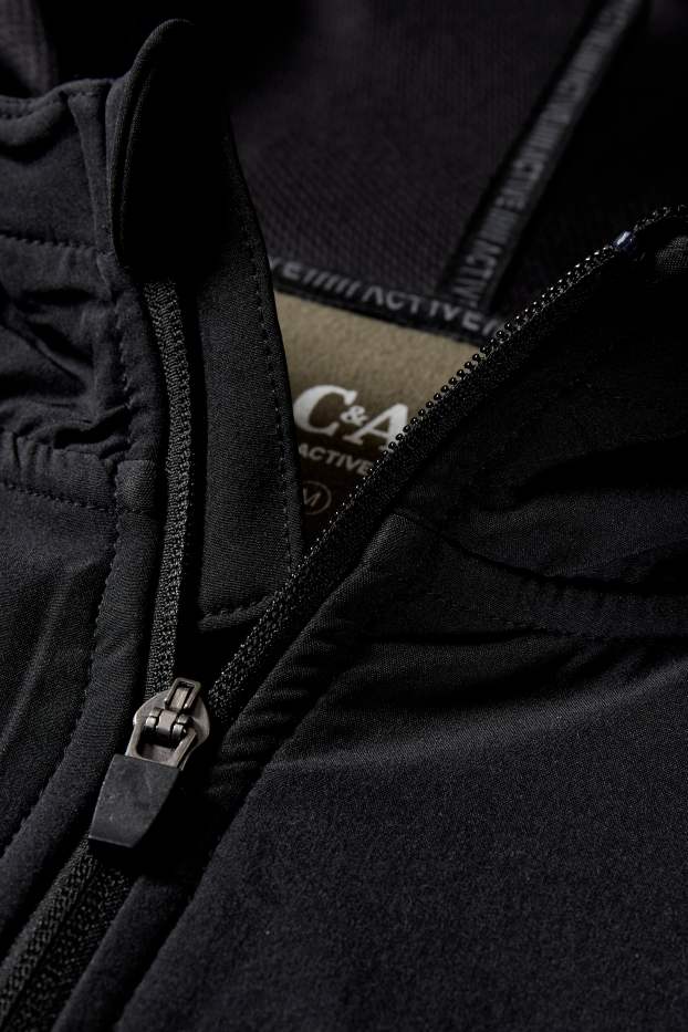 Hommes - Veste en molleton dotée d’une capuche - noir / beige