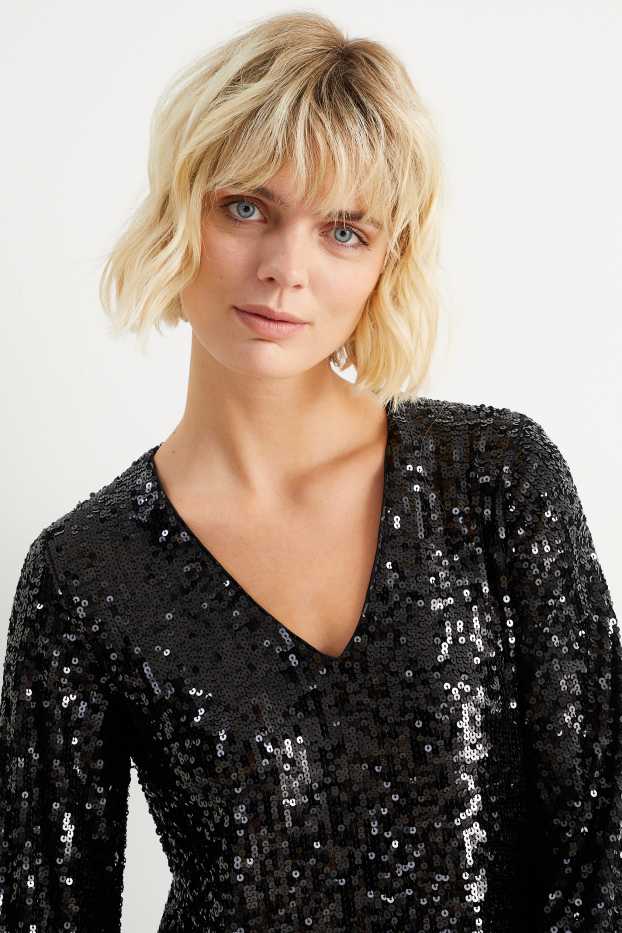 Femmes - Robe en sequins de forme évasée avec encolure en V - noir