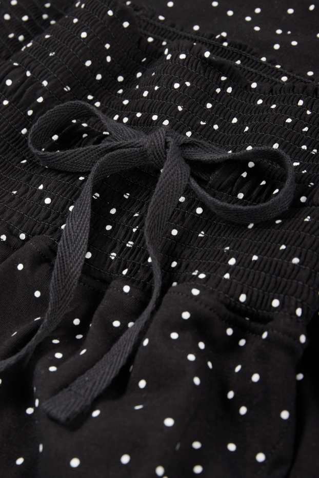 Damen - Umstands-Pyjamahose - gepunktet - schwarz