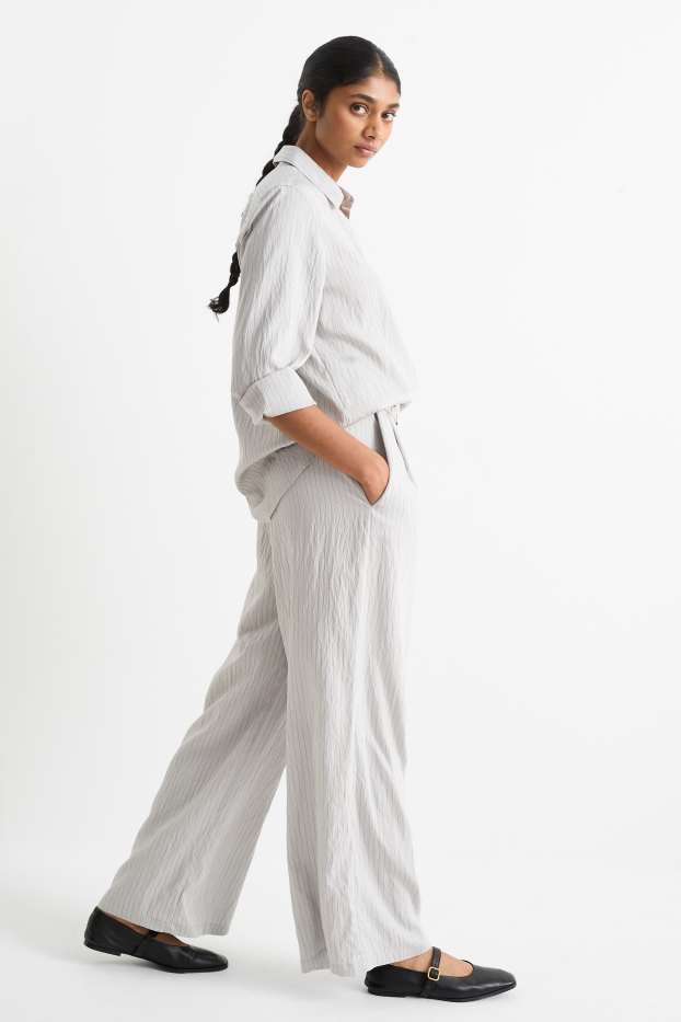 Dámské - Plátěné kalhoty s páskem - high waist - wide leg - úzký proužek - světle šedá