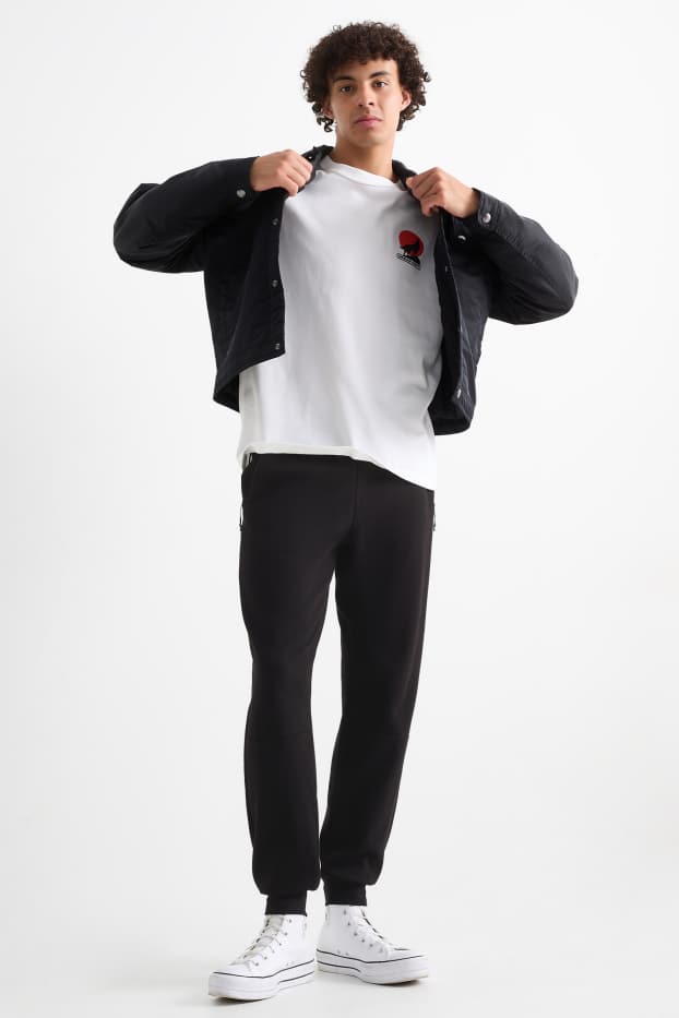 Bărbați - Pantaloni de trening - negru