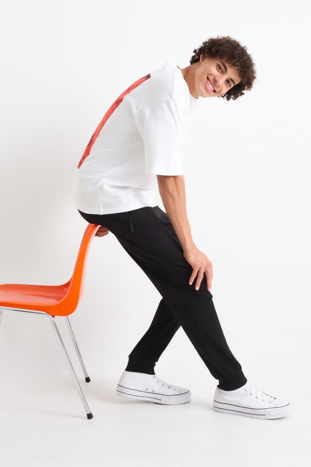 Bărbați - Pantaloni de trening - negru