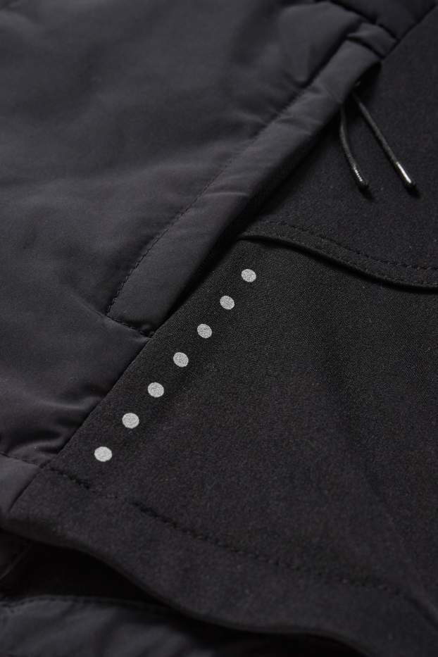 Femmes - Veste chaude de sport à capuche - noir