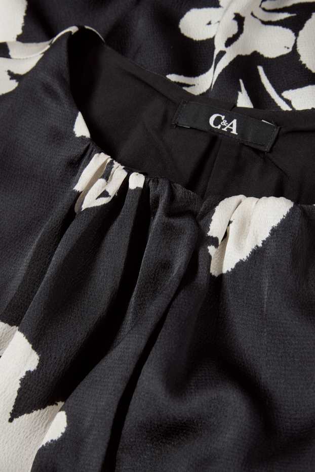 Dona - Vestit acampanat amb mànigues de fanal - de flors - negre
