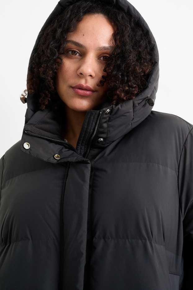Dona - Jaqueta embuatada amb caputxa - resistent a l’aigua - negre