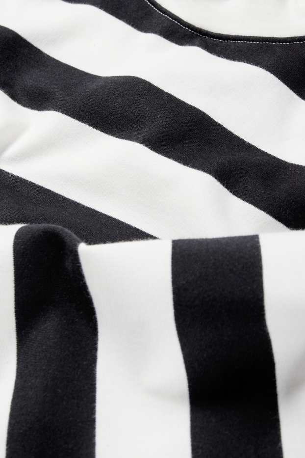 Dona - Dessuadora - de ratlles - negre/blanc