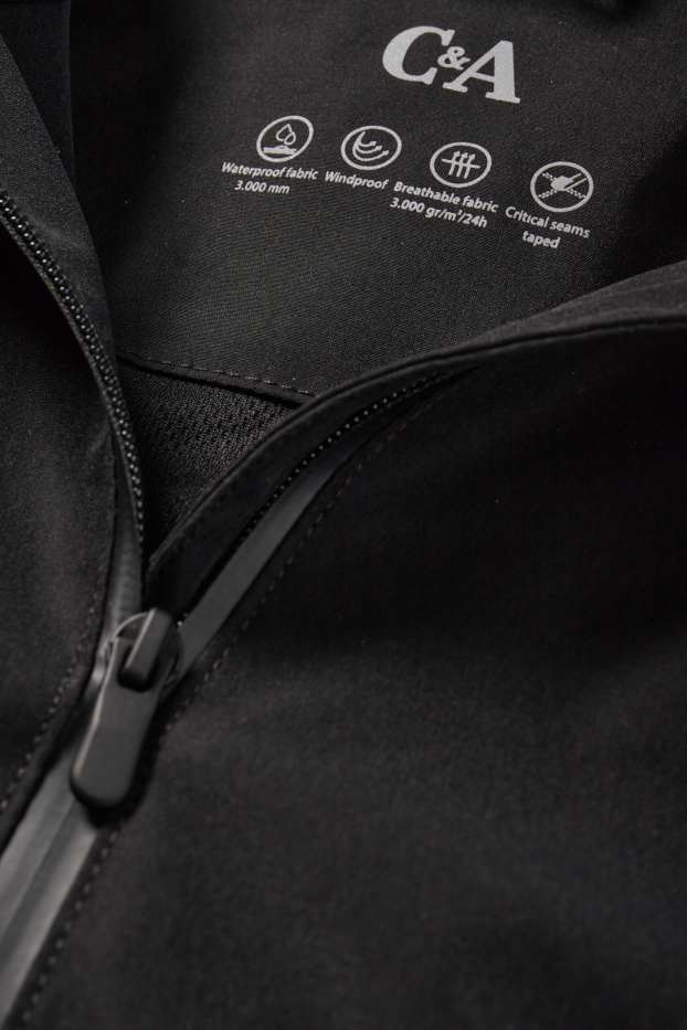 Femmes - Veste de pluie à capuche - imperméable - noir