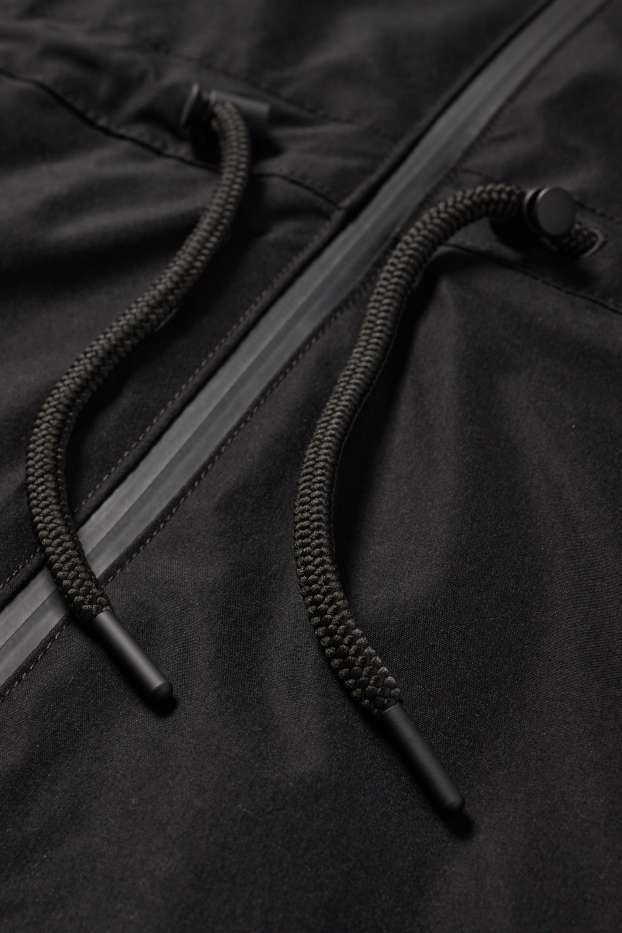 Femmes - Veste de pluie à capuche - imperméable - noir