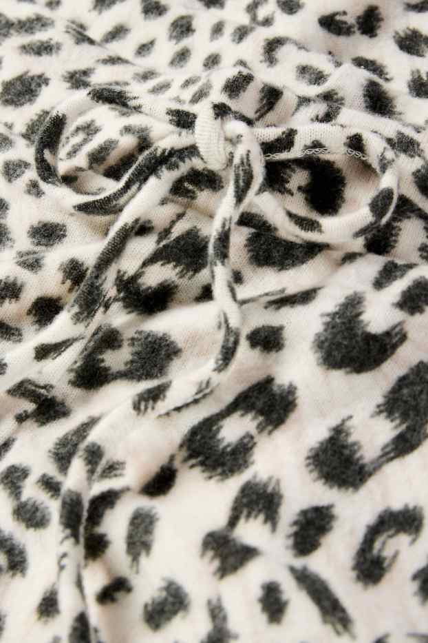 Damen - Flared Leggings - Leo-Print - schwarz / beige