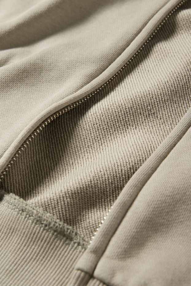Home - Dessuadora oberta oversized amb caputxa - verd