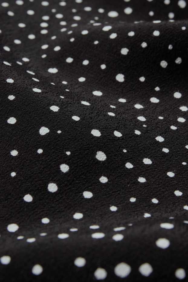 Femmes - Pantalon en toile - high waist - jambe évasée - à pois - noir