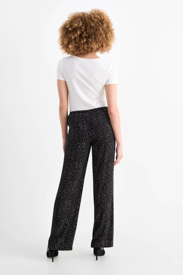 Femmes - Pantalon en toile - high waist - jambe évasée - à pois - noir