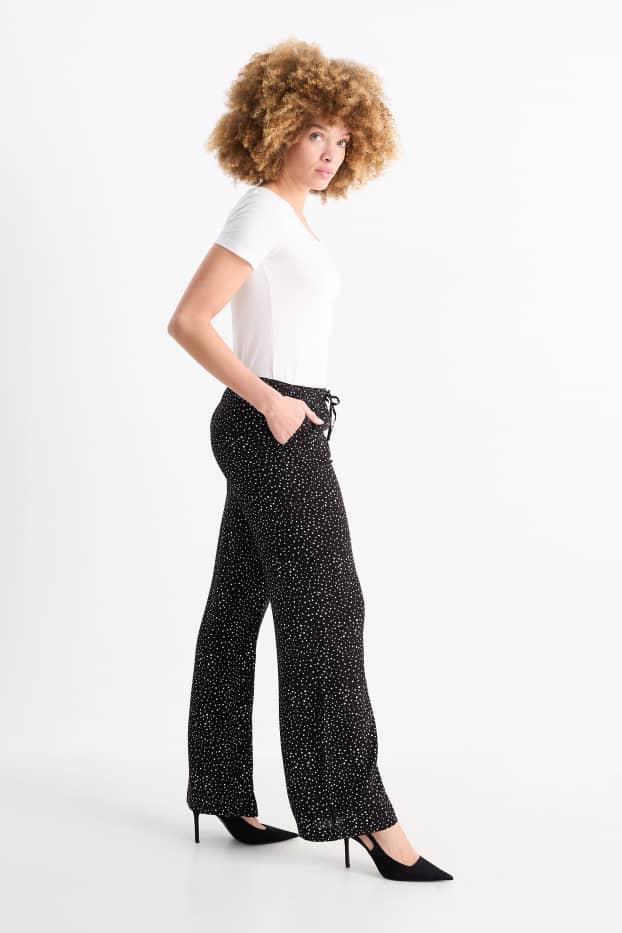 Femmes - Pantalon en toile - high waist - jambe évasée - à pois - noir