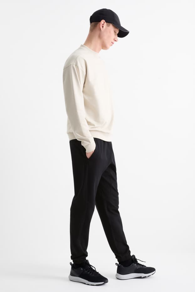 Uomo - Pantaloni sportivi tecnici - nero