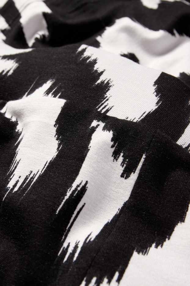 Women - Jersey trousers - high waist - wide leg - patterned - black / white
