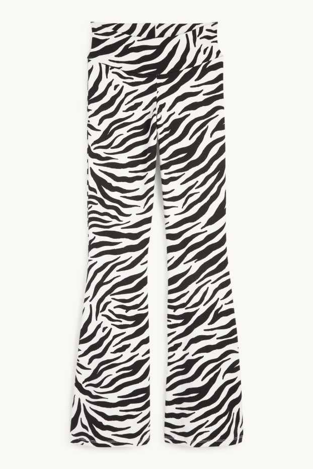 Women - Flared leggings - patterned - black / white
