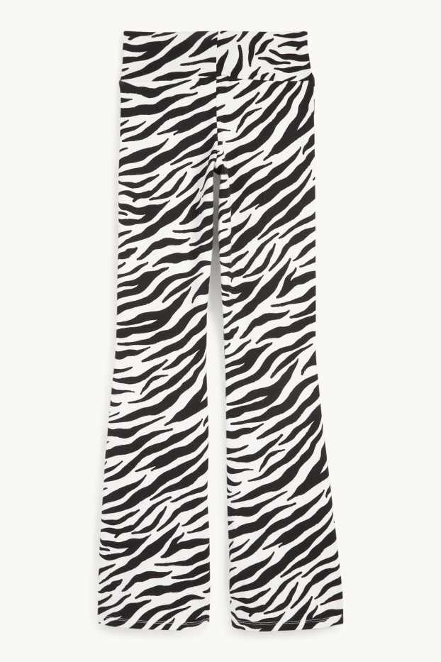 Women - Flared leggings - patterned - black / white