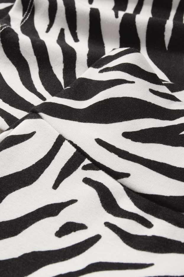 Women - Flared leggings - patterned - black / white