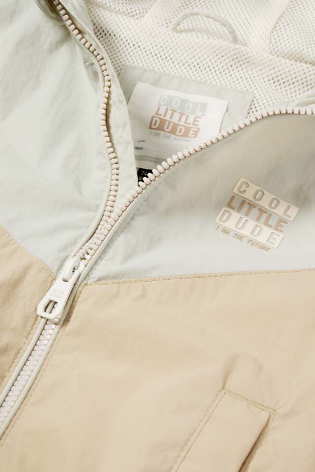 Baby: jongens - Babyjas met capuchon - waterafstotend - beige