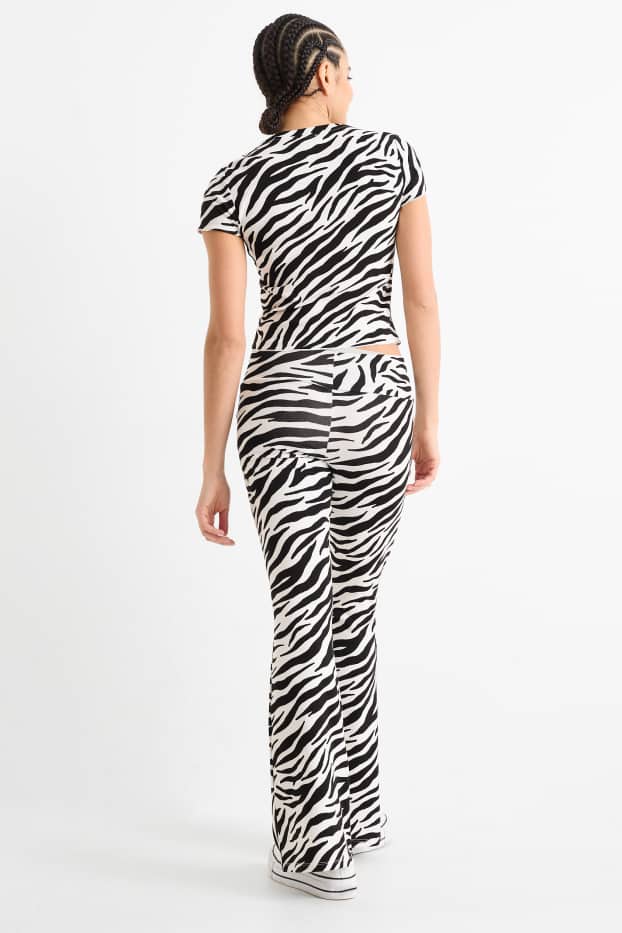 Women - Flared leggings - patterned - black / white