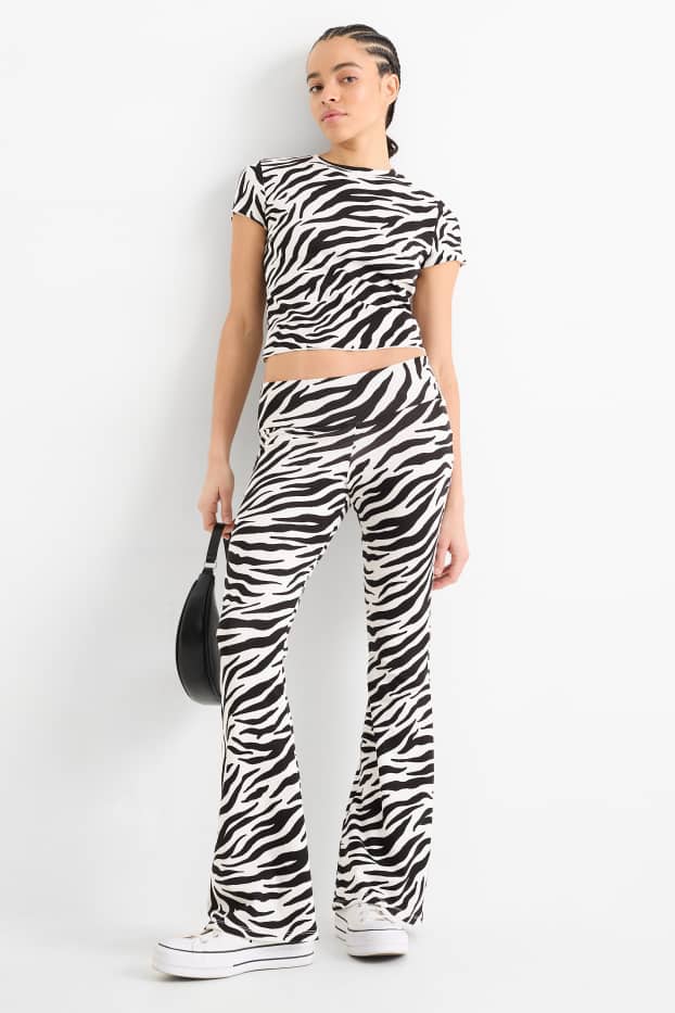 Women - Flared leggings - patterned - black / white