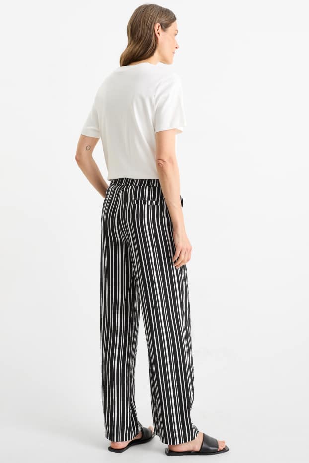 Women - Cloth trousers - high waist - wide leg - striped - black / white