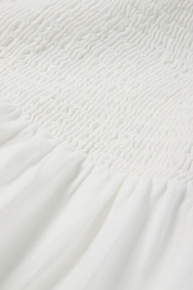 Damen - A-Linien Kleid - Broderie Anglaise - gesmokt - weiß