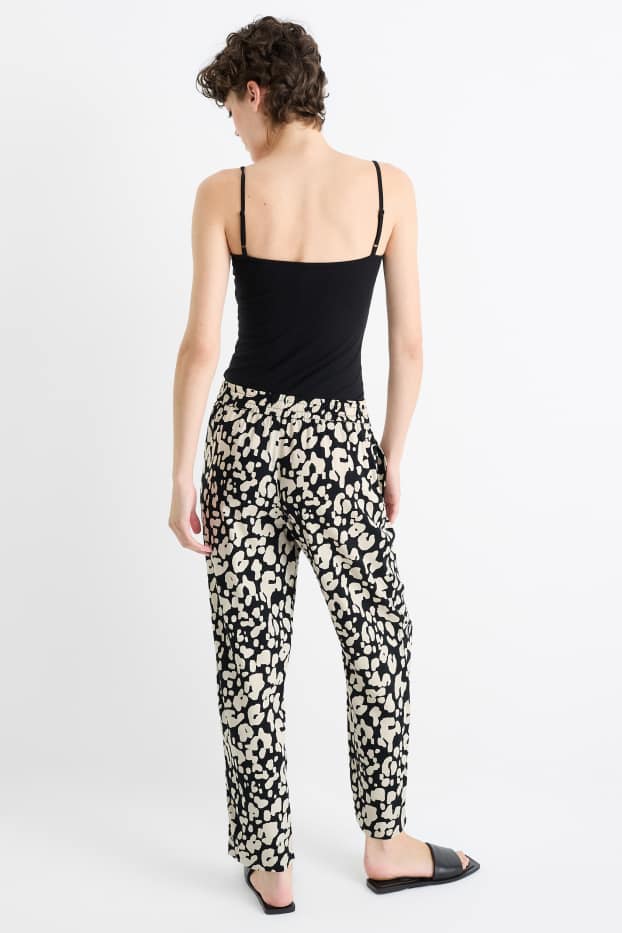Femmes - Pantalon en toile - high waist - tapered fit - imprimé léopard - noir / beige