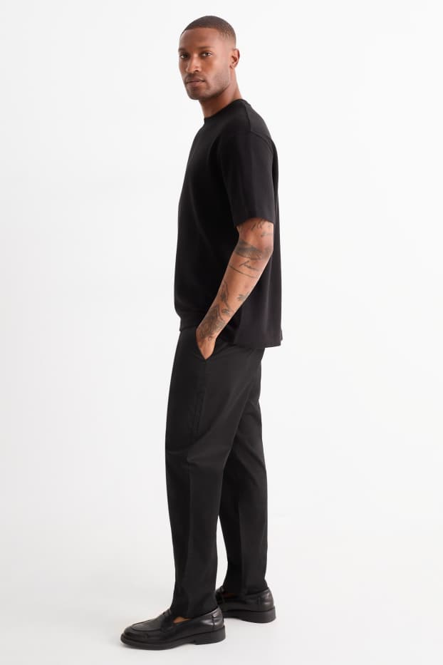Pánské - Kalhoty chino - tapered fit - černá