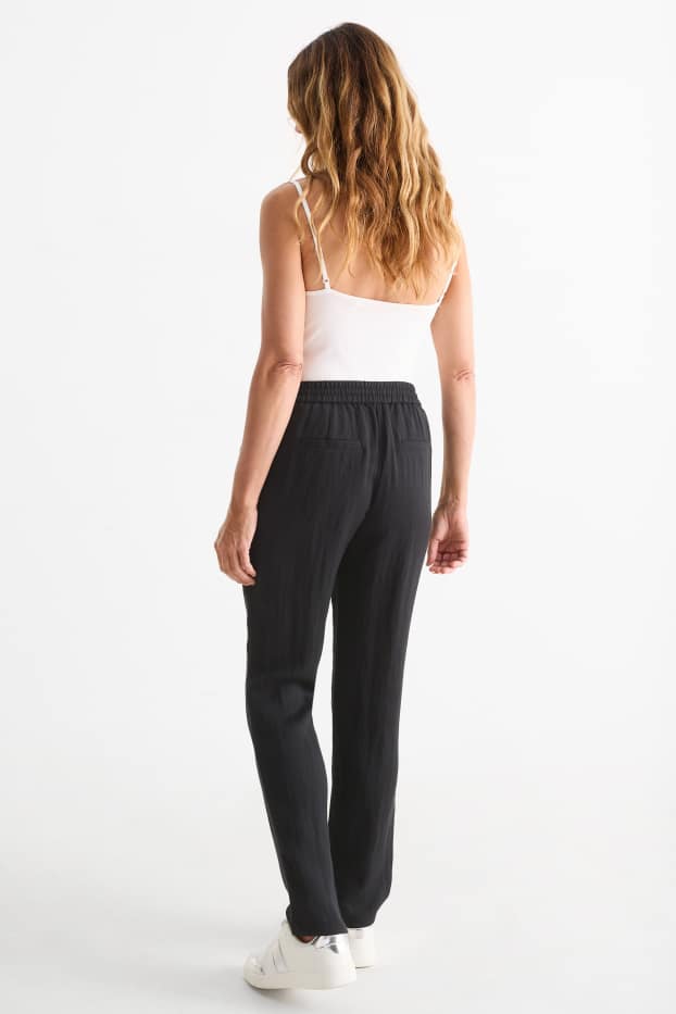 Femmes - Pantalon en toile - mid waist - tapered fit - noir