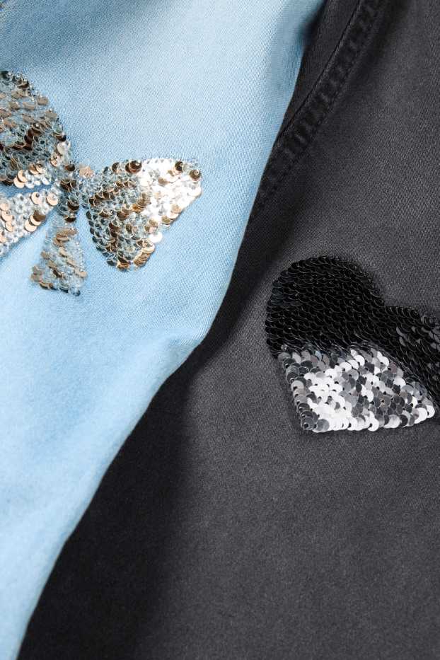 Kinderen: meisjes - Set van 2 - hart en strik - flared jeans - zwart