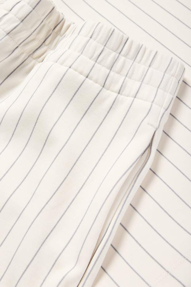 Dames - Broek van jersey - mid waist - straight fit - met strepen - crème wit