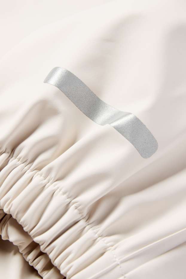 Baby Mädchen - Baby-Regenhose - wasserdicht - hellbeige