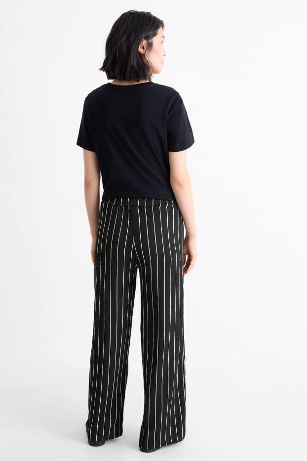 Dames - Broek van jersey - mid waist - loose fit - gestreept - zwart / wit