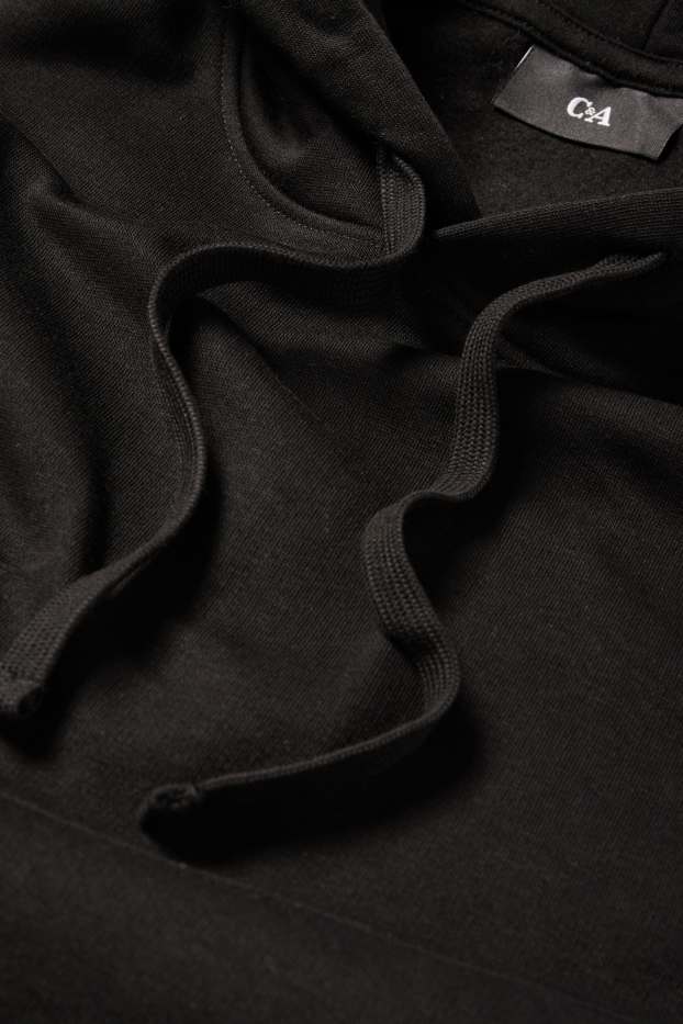 Home - Dessuadora amb caputxa - negre