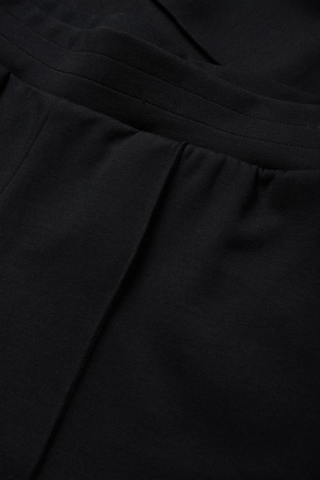 Women - Jersey trousers - mid-rise waist - straight fit - black