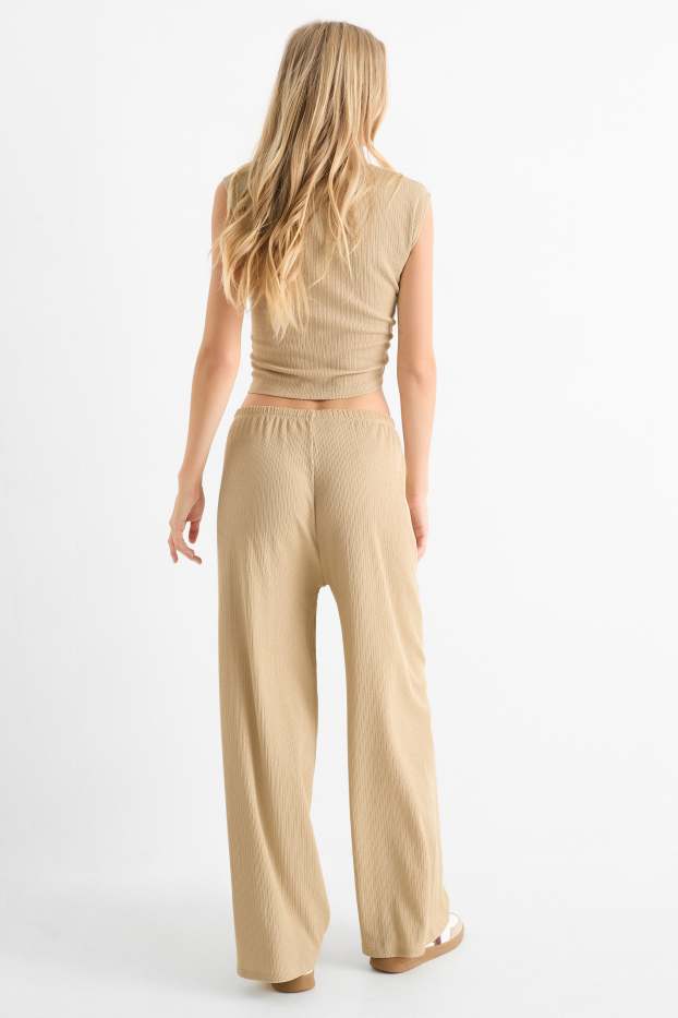 Femmes - Pantalon en jersey - mid waist - wide leg - finition texturée - beige