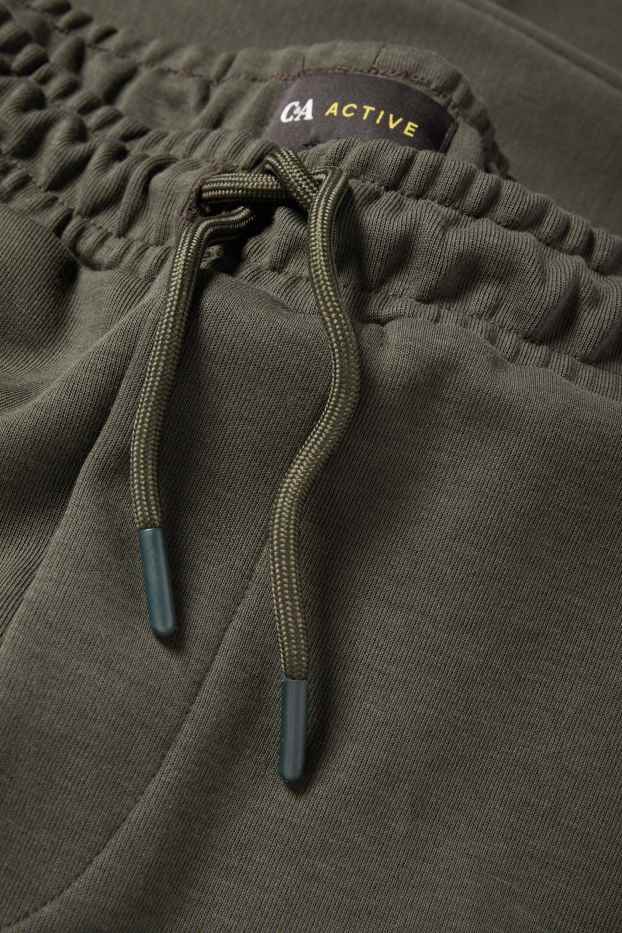 Bărbați - Pantaloni de trening funcționali - verde închis