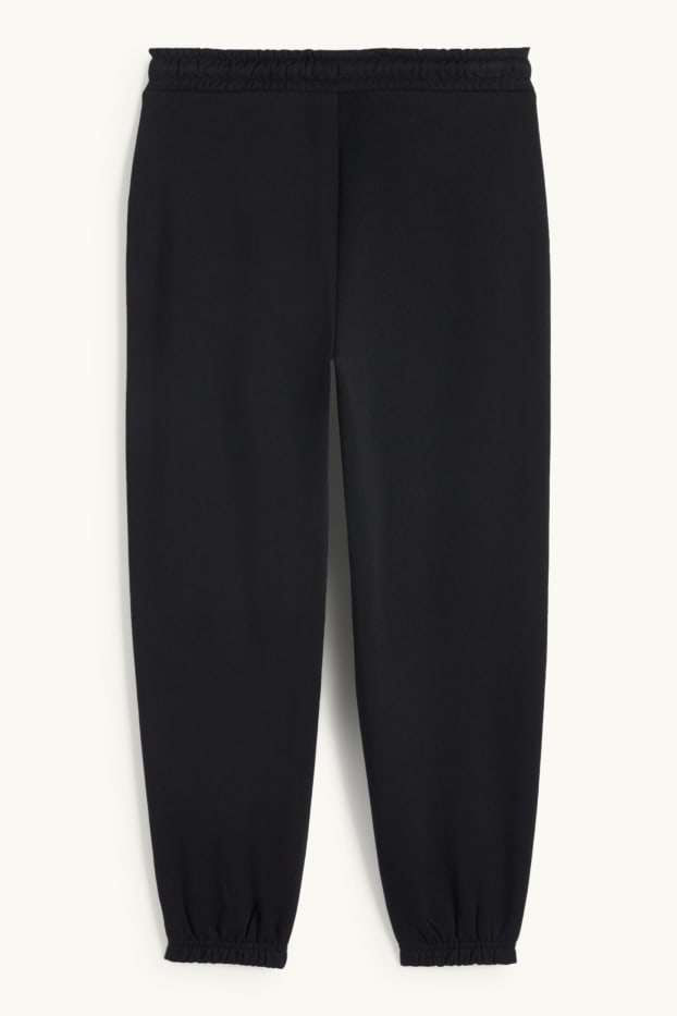 Nen - Halloween - esquelet - pantalons de xandall - brilla en la foscor - negre