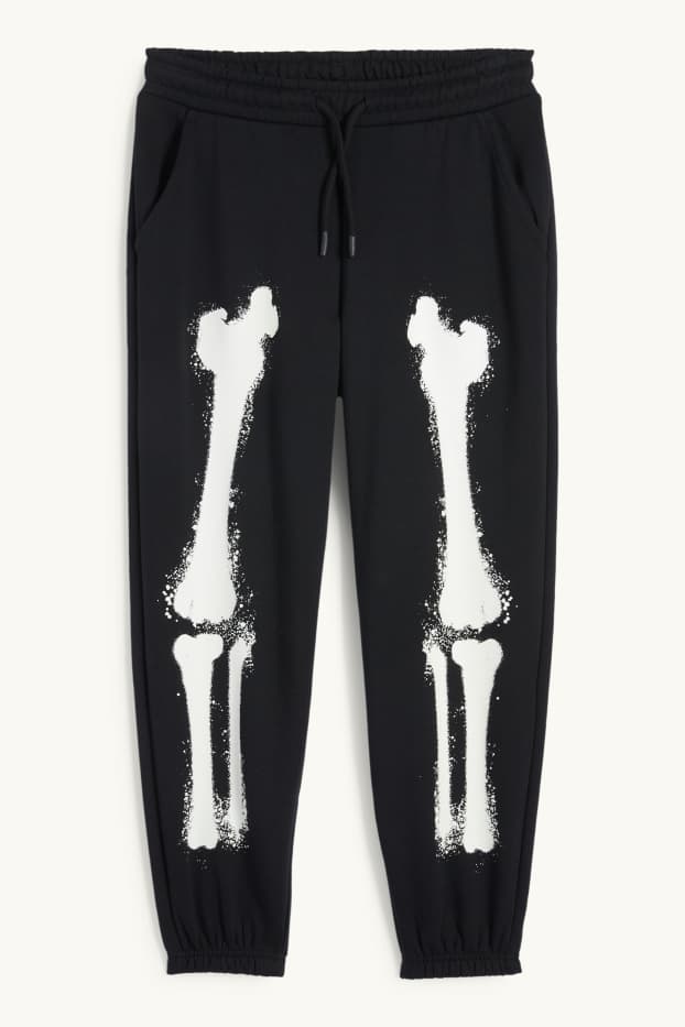 Nen - Halloween - esquelet - pantalons de xandall - brilla en la foscor - negre