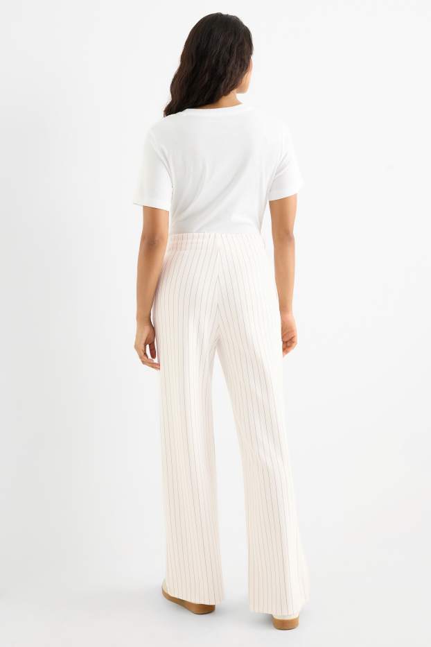 Dames - Broek van jersey - mid waist - straight fit - met strepen - crème wit
