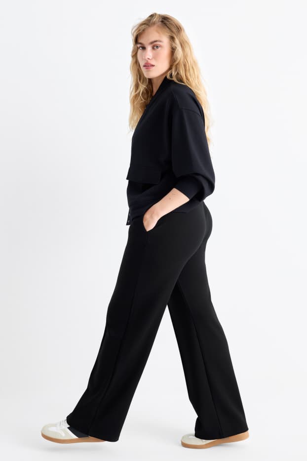 Women - Jersey trousers - mid-rise waist - straight fit - black