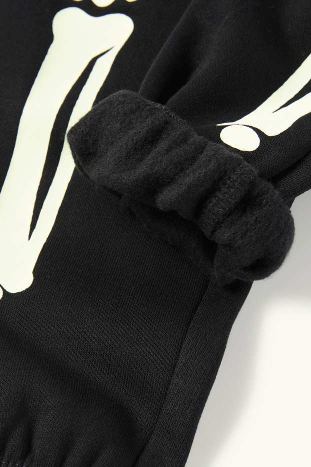 Kinderen: jongens - Halloween - skelet - joggingbroek - glow in the dark - zwart