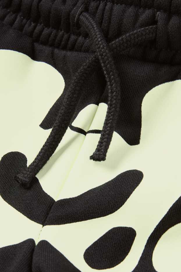 Kinderen: jongens - Halloween - skelet - joggingbroek - glow in the dark - zwart